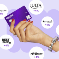 a hand holding a credit card